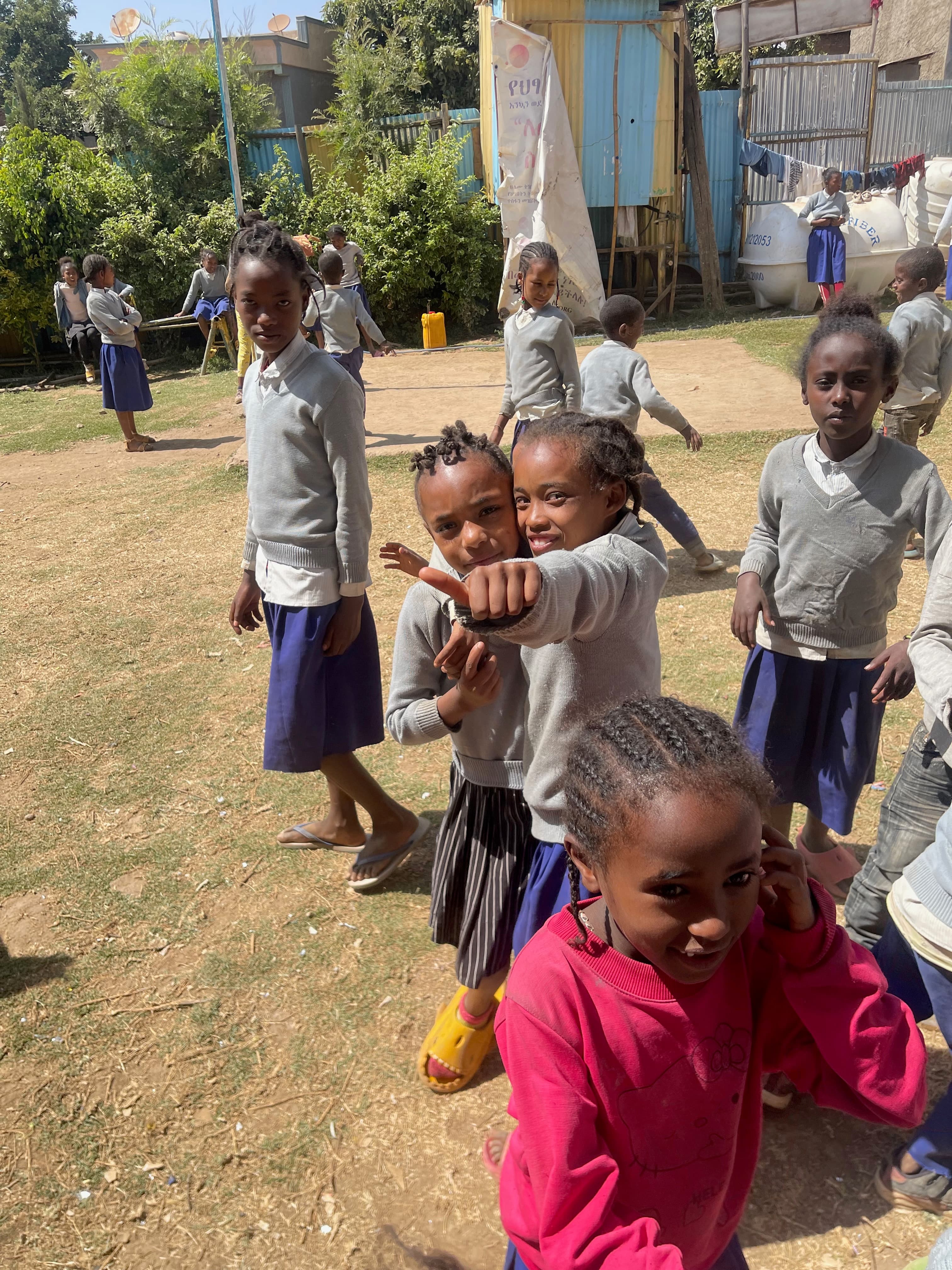 Children playing and smiling at the BTCO school grounds today